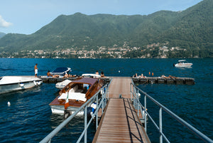 lakeside swim at Cernobbio on Lake Como. A European summer on the lake nearby to famous Villa D Este and popular swimming spot