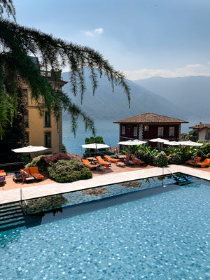 A European summer lakeside at the Grand Hotel Tremezzo Lake Como.  Slim Aarons and celebrity lifestyle poolside. La Dolce Vita. Lake Como's most beautiful luxury hotel .