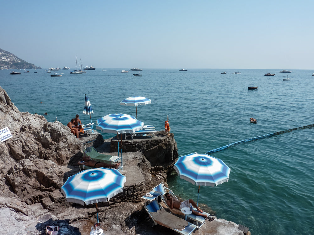 European summer at Positano on the Amalfi Coast, Italy. A day at the beach, seaside swimming in the mediterranean